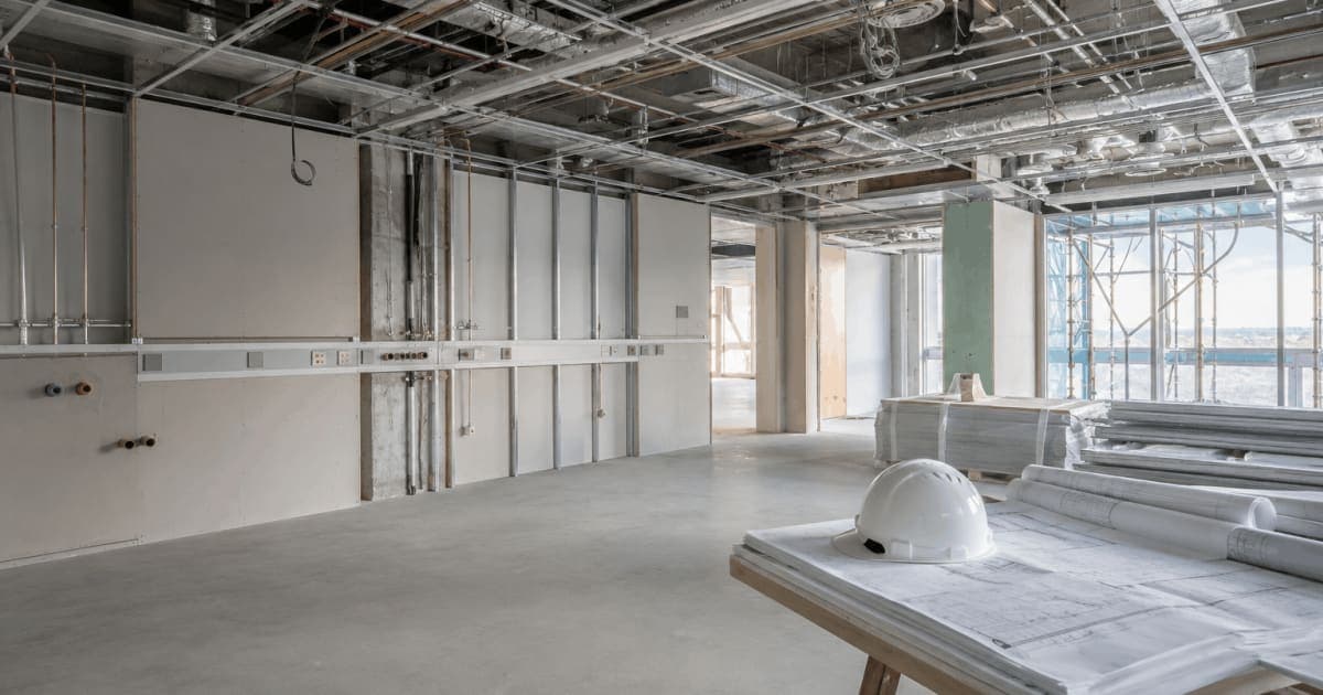Medical clinic under fit-out with exposed ceiling services and construction drawings